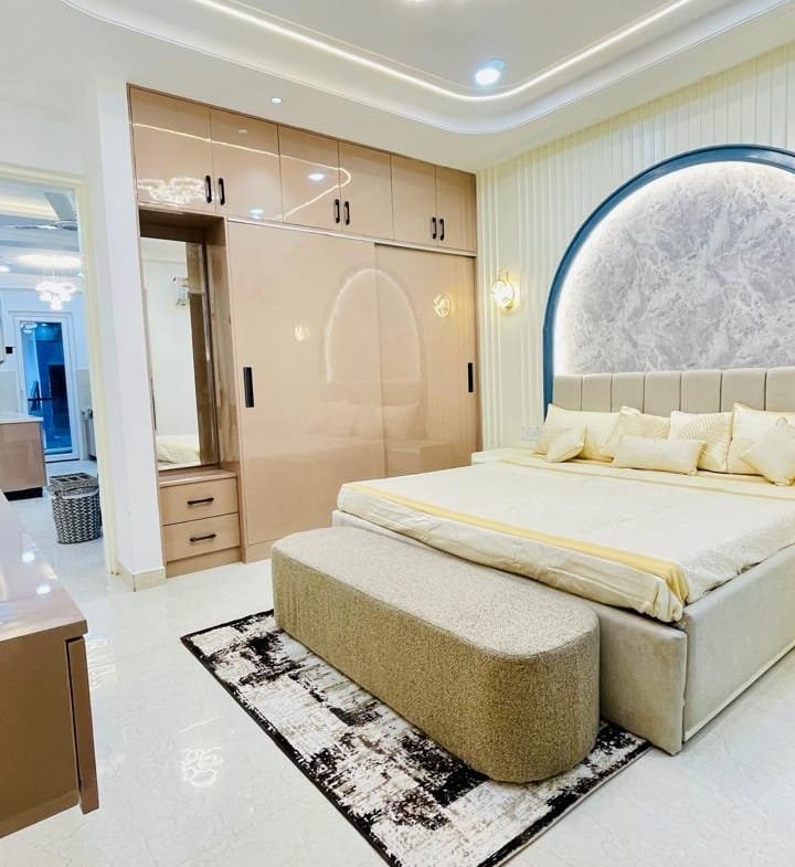 Master bedroom in Aggersen Enclave with LED panels and full-size wardrobe space