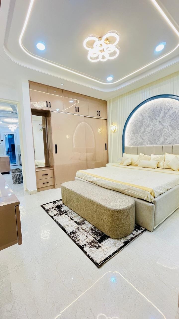Master bedroom in Aggersen Enclave with LED panels and full-size wardrobe space