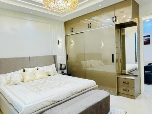 Master bedroom in Aggersen Enclave with LED panels and full-size wardrobe space