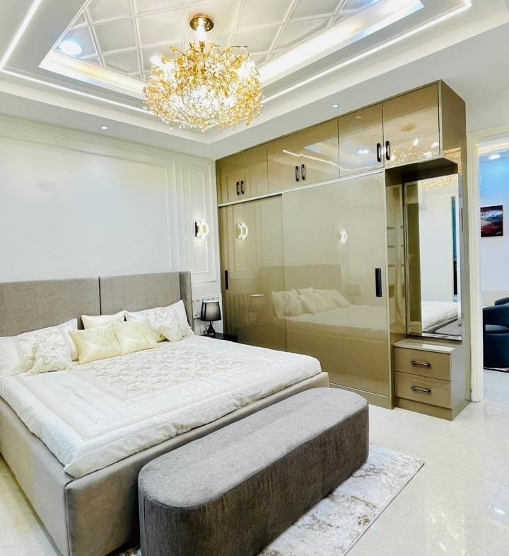 Master bedroom in Aggersen Enclave with LED panels and full-size wardrobe space