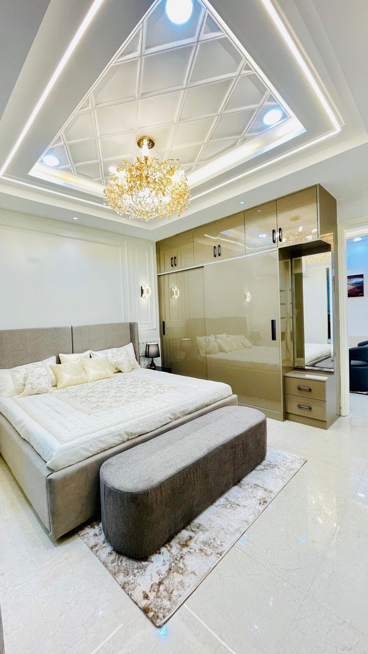 Master bedroom in Aggersen Enclave with LED panels and full-size wardrobe space