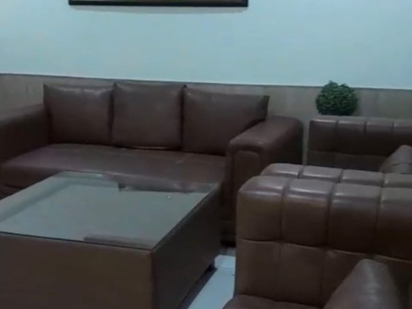 Spacious furnished living room with sofa set and AC in 4BHK flat at GHB Splande Zirakpur
