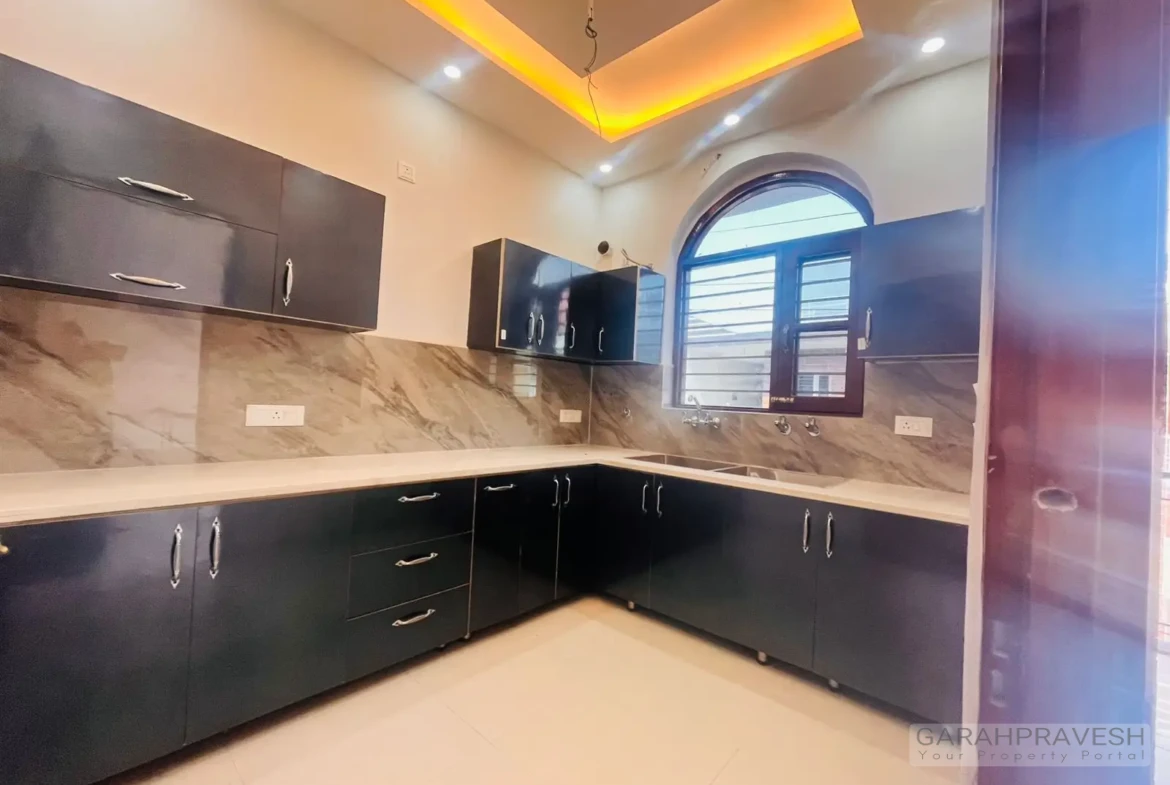 Contemporary modular kitchen with sleek wooden cabinetry and modern fittings