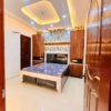 Master bedroom with premium wooden wardrobe and designer lighting