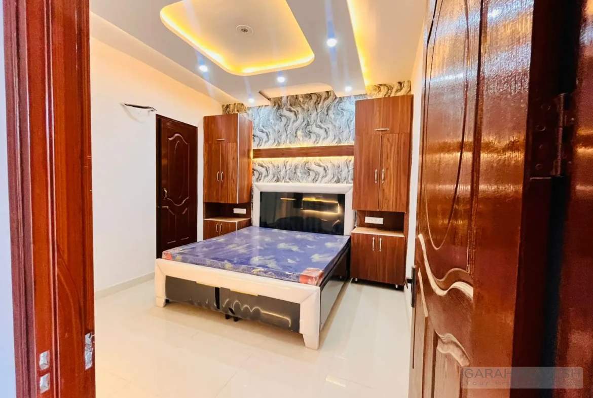 Master bedroom with premium wooden wardrobe and designer lighting