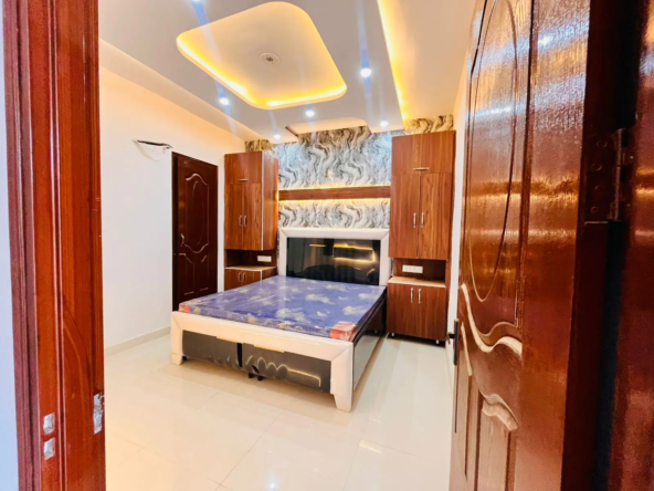 Master bedroom with premium wooden wardrobe and designer lighting