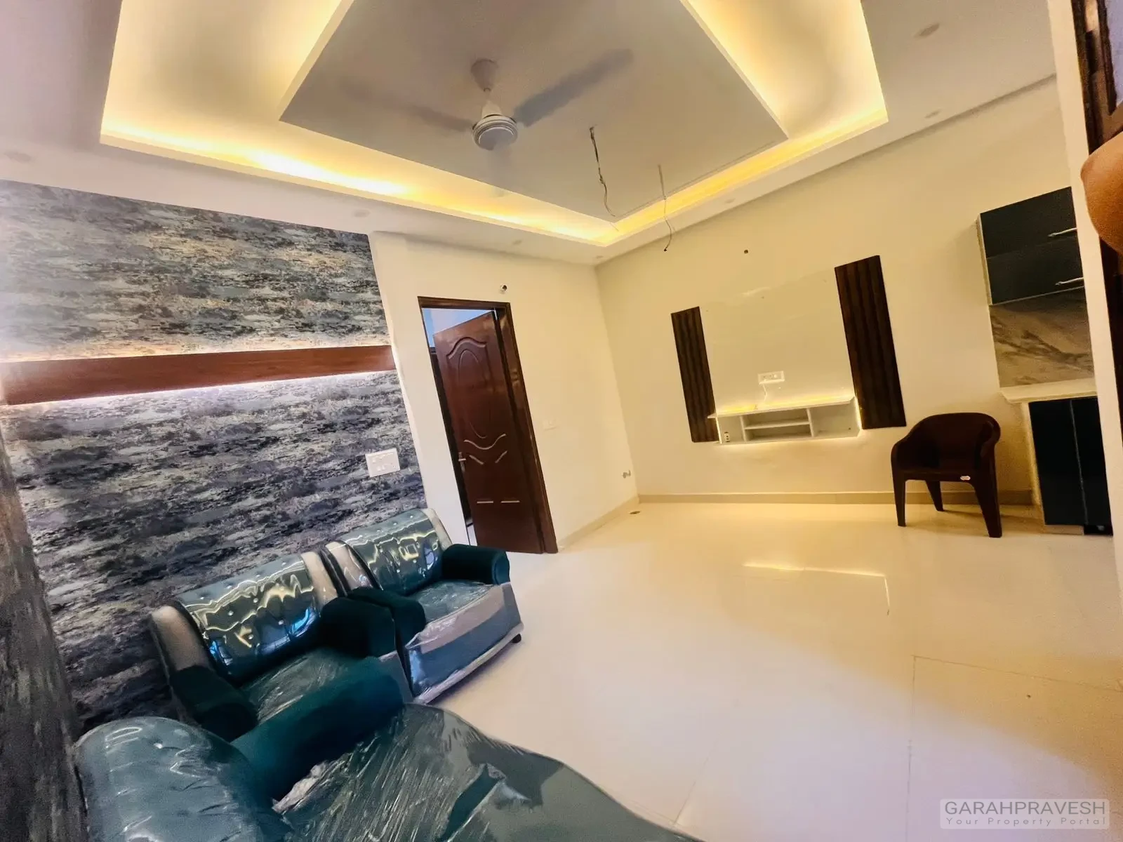 Bright and airy living room with stylish wallpaper and wooden finishes