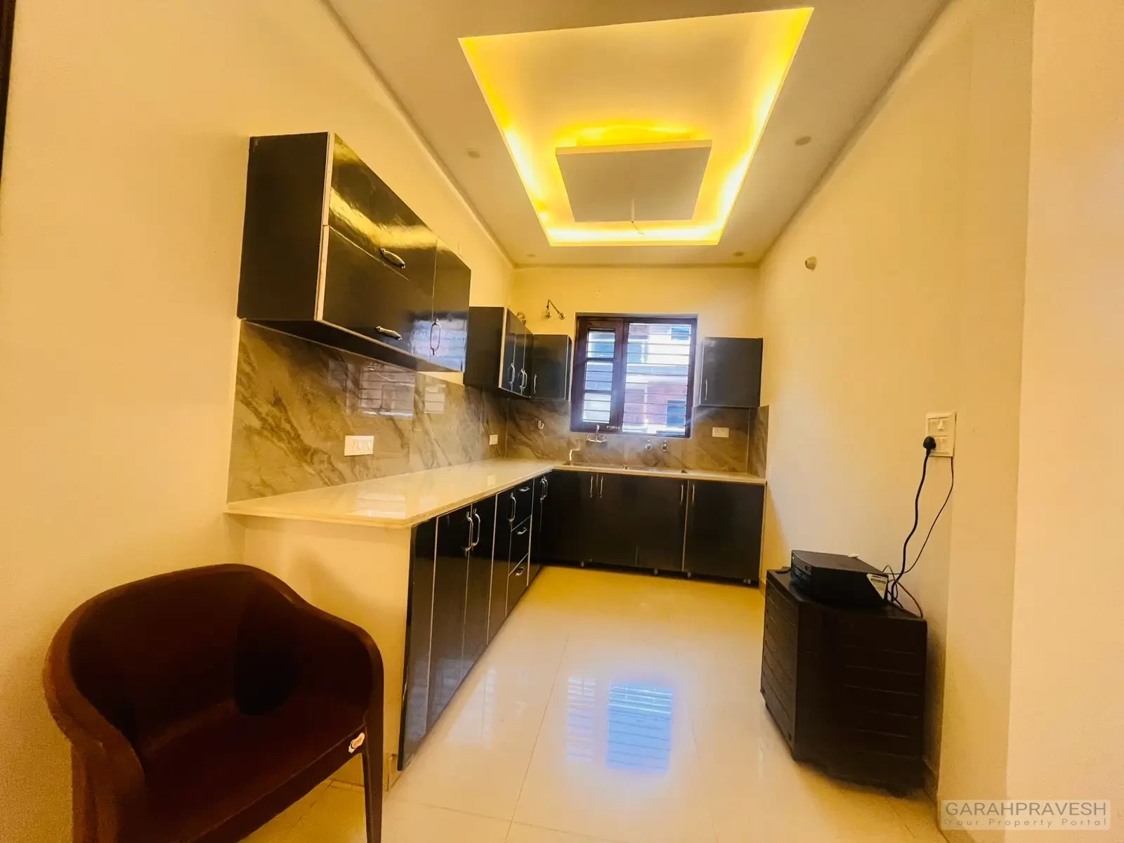 Contemporary modular kitchen with sleek wooden cabinetry and modern fittings