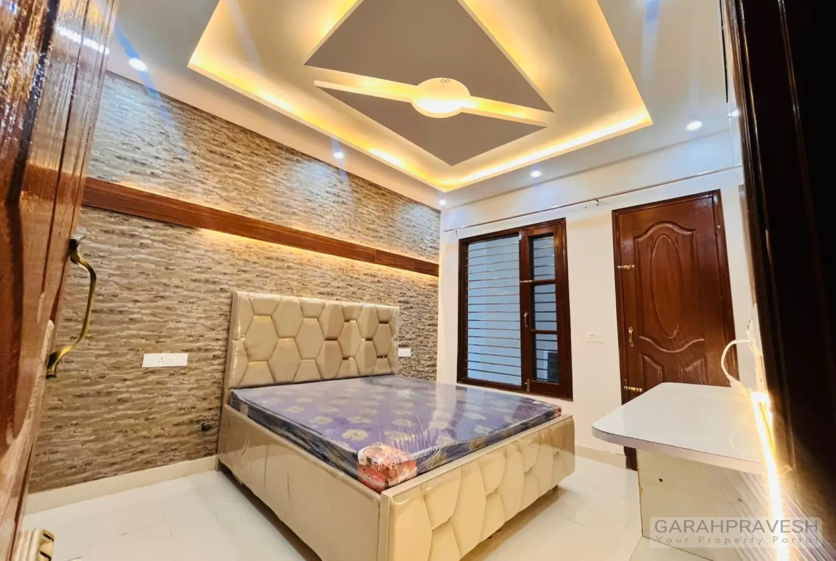 Master bedroom with premium wooden wardrobe and designer lighting