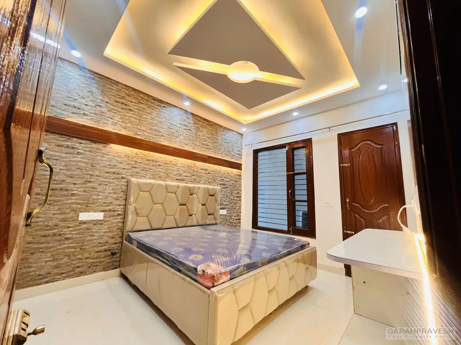 Master bedroom with premium wooden wardrobe and designer lighting