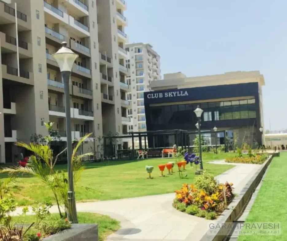 Luxury 4+1BHK apartments at Uptown Skylla Zirakpur with modern glass facade and landscaped gardens