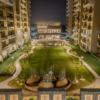 Luxury 4+1BHK apartments at Uptown Skylla Zirakpur with modern glass facade and landscaped gardens