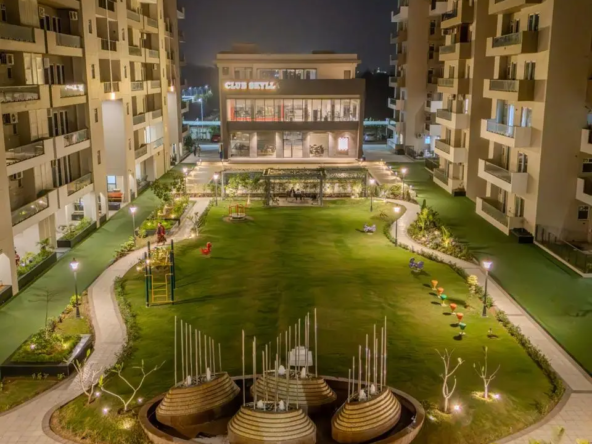 Luxury 4+1BHK apartments at Uptown Skylla Zirakpur with modern glass facade and landscaped gardens
