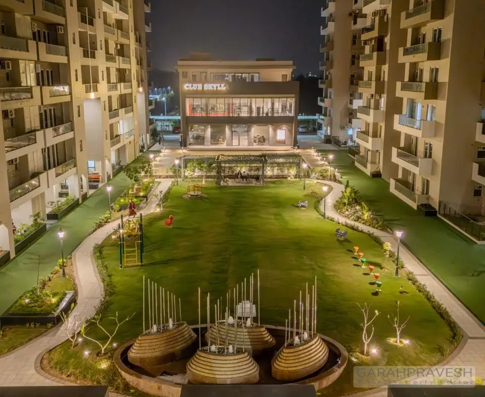 Luxury 4+1BHK apartments at Uptown Skylla Zirakpur with modern glass facade and landscaped gardens