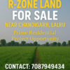 R-Zone land for sale near Chandigarh in Lalru, ideal for residential projects, with contact info and green field background.