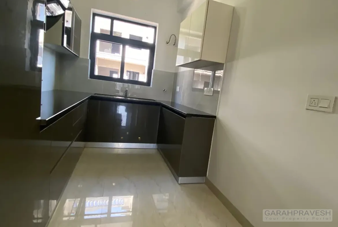 Modular kitchen space in 1600 sqft Motia Aero Greens apartment