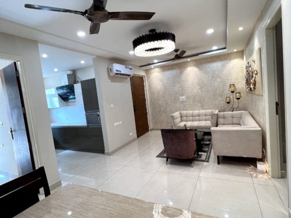 Fully furnished 3BHK designer flat for sale in Zirakpur with brand new furniture, lift access, modular kitchen, and spacious layout in a gated society near Patiala Road.
