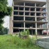 Independent commercial building for sale in Zirakpur on NH-22 near Cosmo Mall – prime location with 1 lakh sq ft built-up area, G+5 floors.